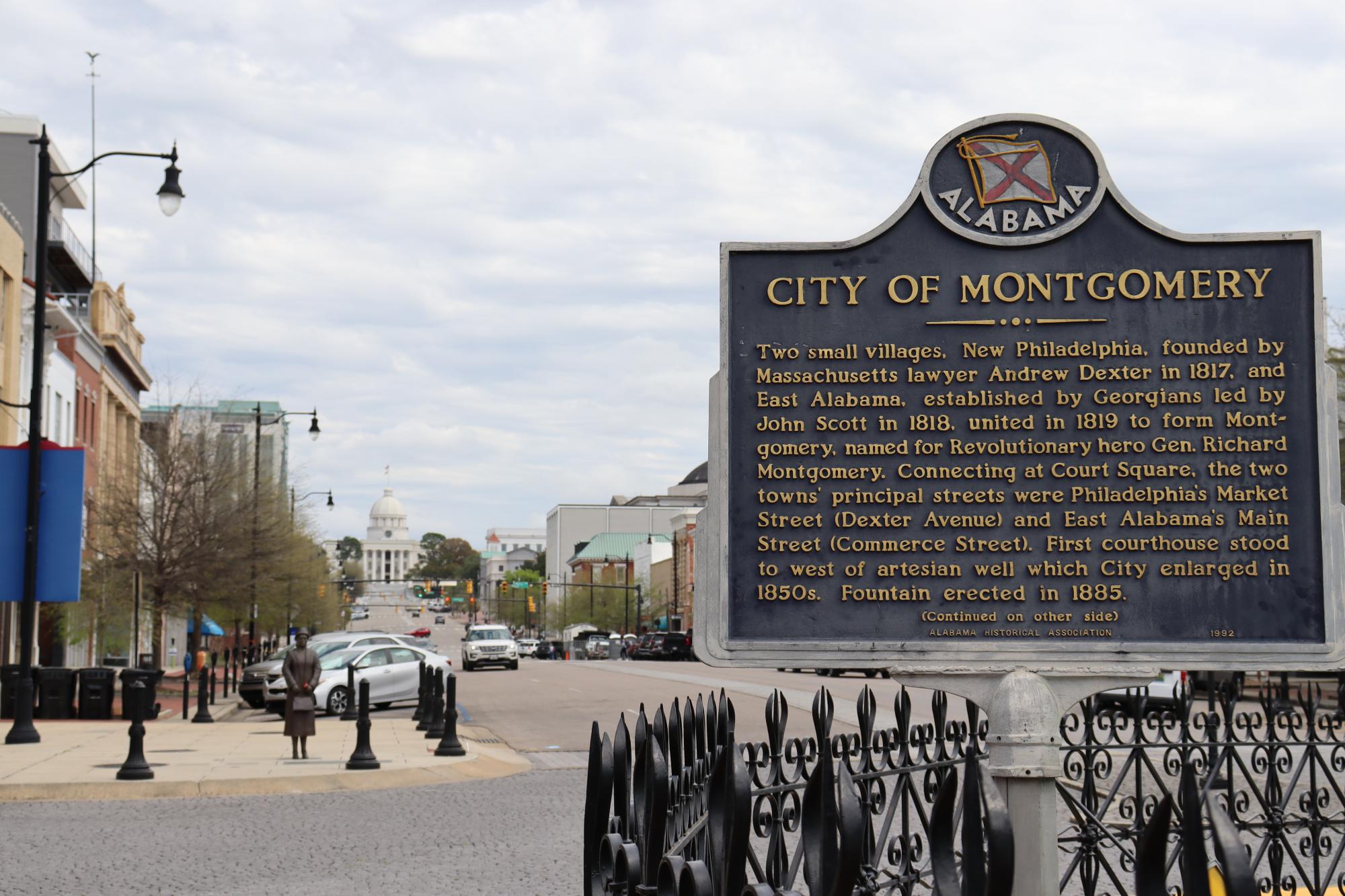 plaque for Montgomery, Alabama in the foreground, Alabama capitol building in the background