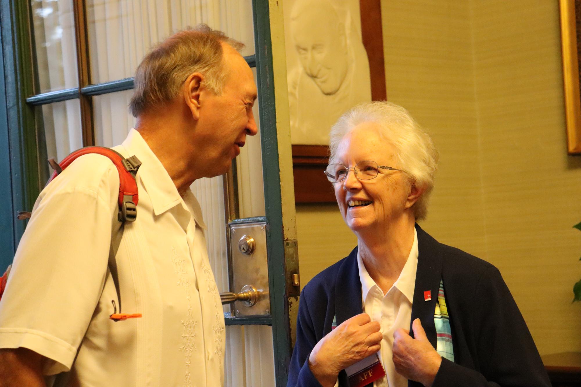 Sr. Eileen Reilly greets guest at the door