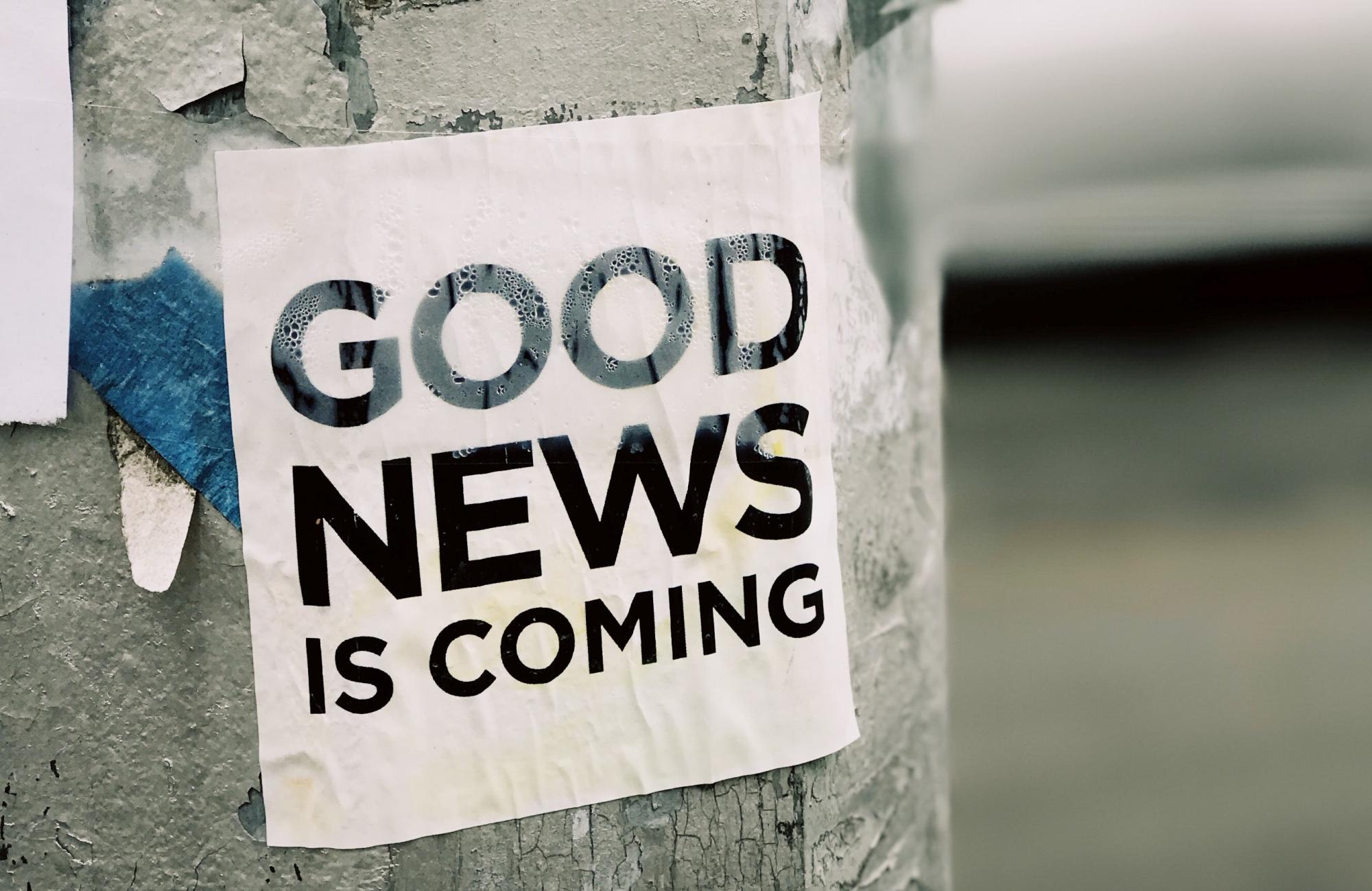 Sign reading &quot;Good news is coming&quot;