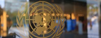 United Nations logo on glass door