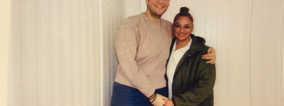 Cody poses with his mom for a photo during a visit in prison