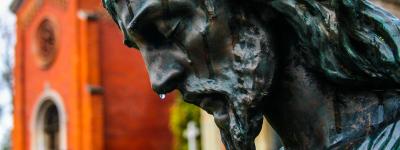 Statue of Jesus with water dripping down his face